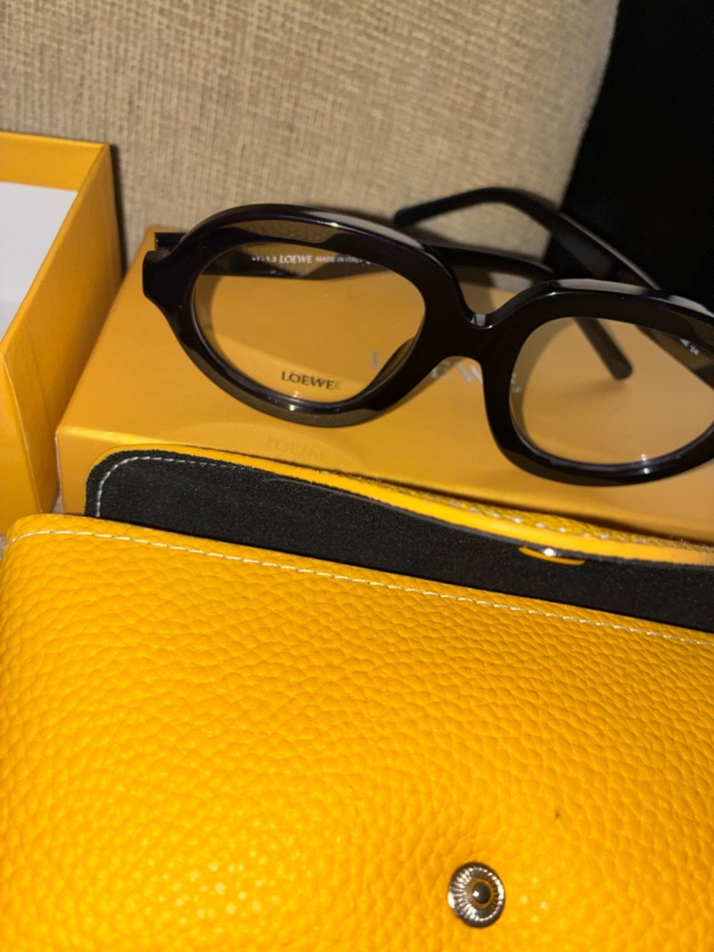 Loewe Black Oval Sunglasses with Yellow Case